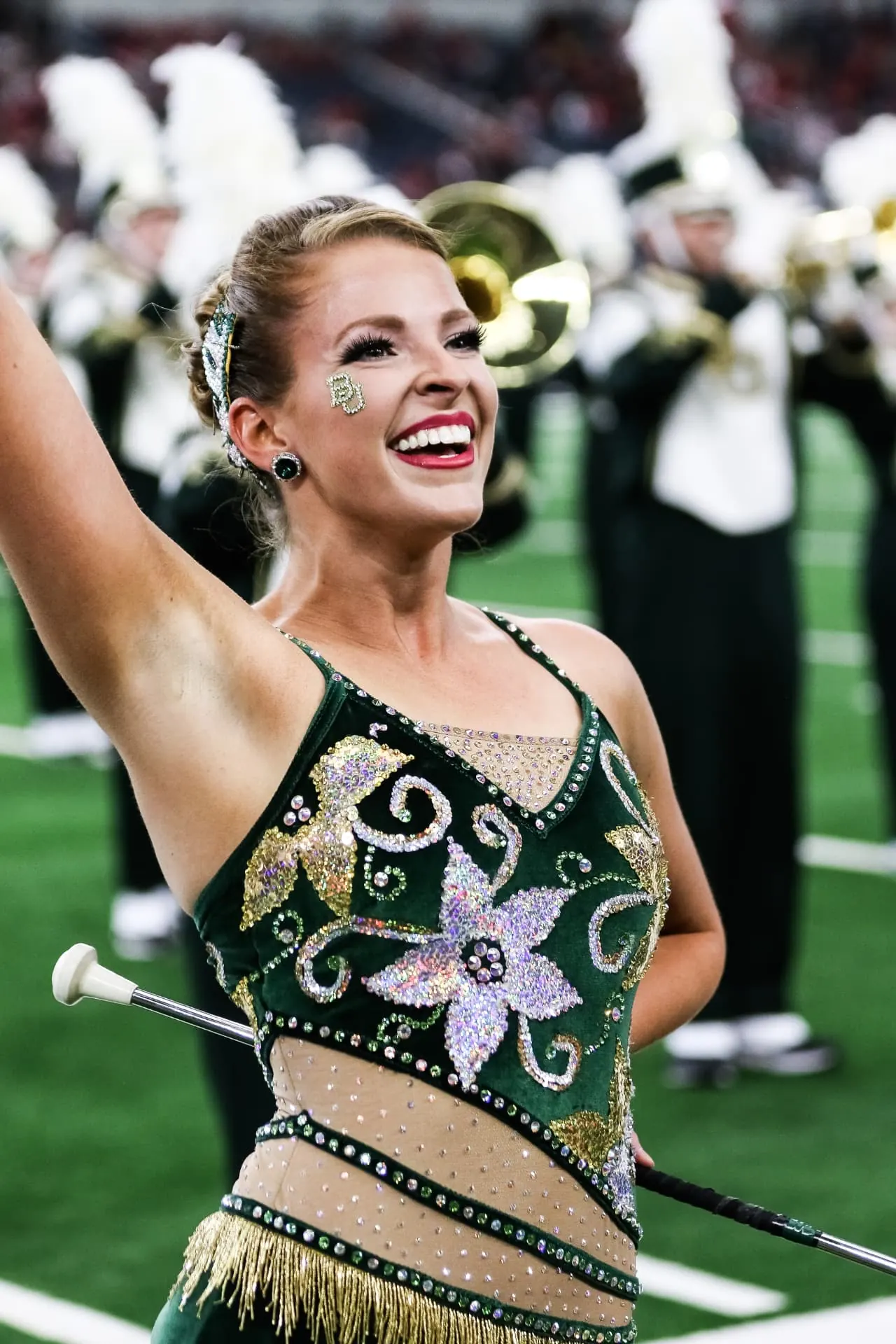 Feature twirler performing in a stadium