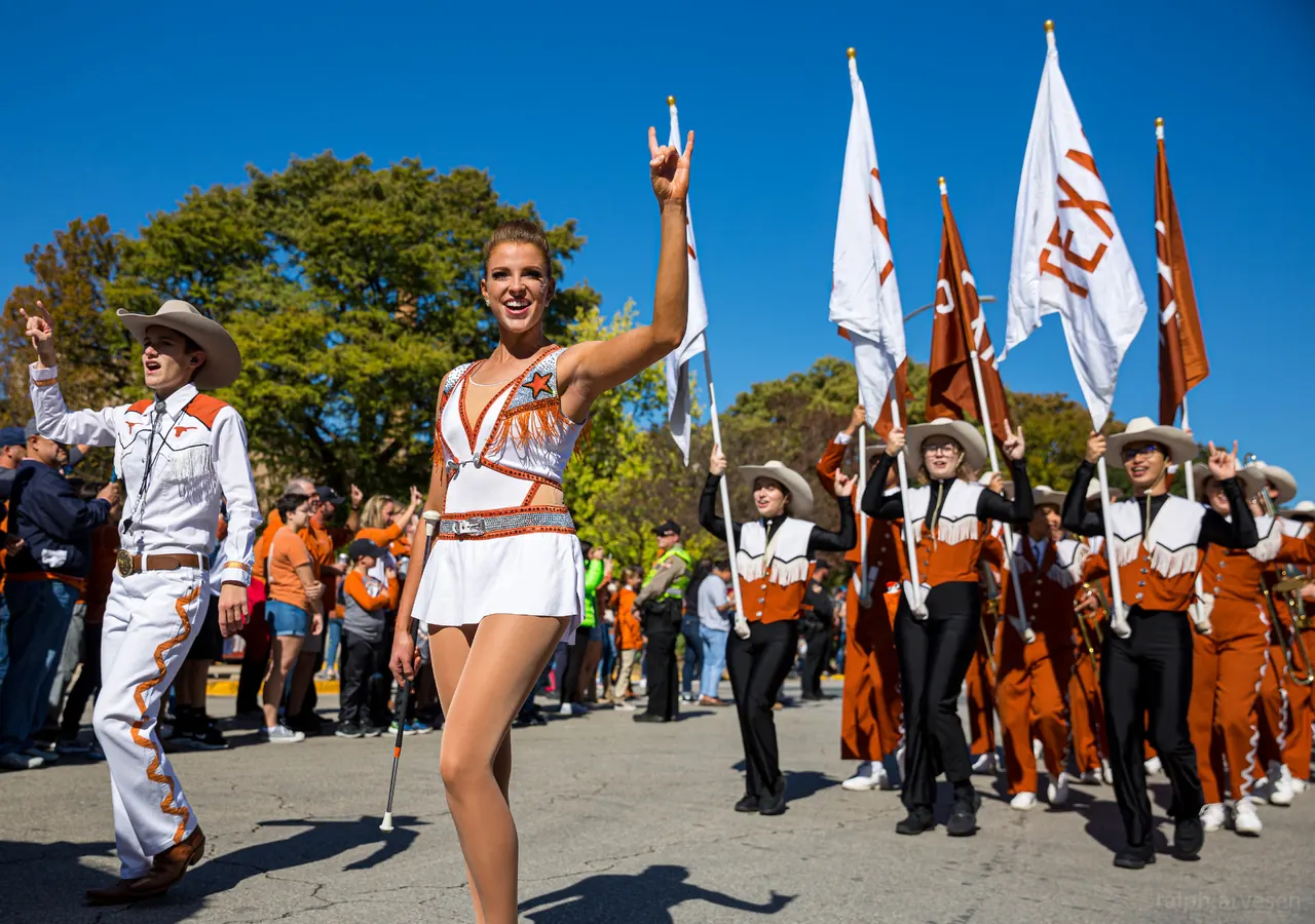 Feature twirler leading the Longhorn band on game day